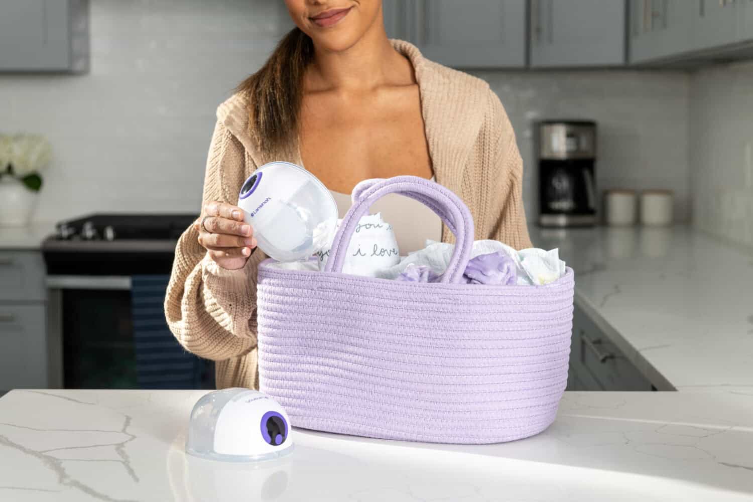 Women carrying lansinoh discreet duo and supplies in bag